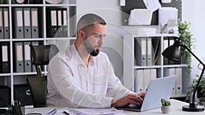 Specialist Working With Laptop In Office