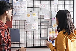 Specialists creating a prototype user experience interface