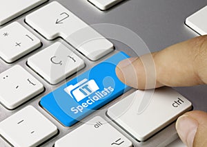 IT Specialists - Inscription on Blue Keyboard Key
