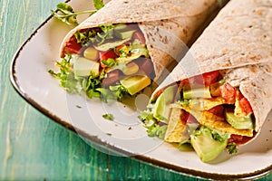 Speciality tortilla wraps with nachos and avocado