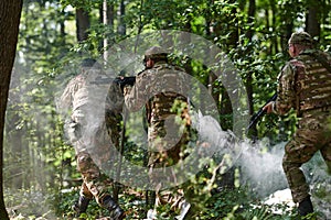 A specialized military antiterrorist unit conducts a covert operation in dense, hazardous woodland, demonstrating