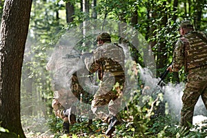 A specialized military antiterrorist unit conducts a covert operation in dense, hazardous woodland, demonstrating