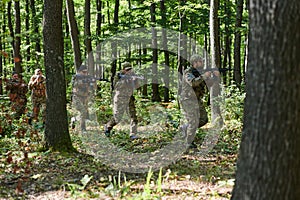 A specialized military antiterrorist unit conducts a covert operation in dense, hazardous woodland, demonstrating