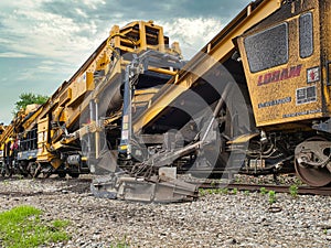 A specialized train that does ballast and roadbed  maintenance for rail ways. photo