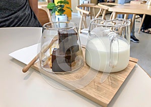 Specialty menu of frozen latte coffee in cube shape with fresh milk in cafe
