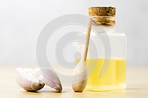 The specificity of onion on the flu. Healing juice in a vial on photo