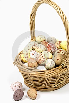 Speckled eggs in wicker basket