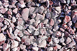 Speckled peeble stones surface as natural background