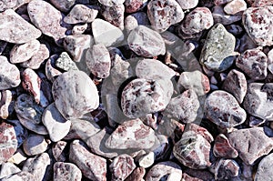 Speckled peeblestones surface as natural background