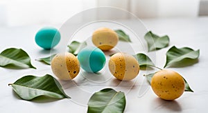 Speckled yellow and solid blue eggs are arranged on a smooth white surface,