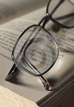Spectacles on book page
