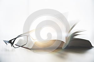 Spectacles and open book