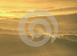 Spectacular aerial view of hills silhouettes and misty valleys