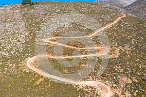 Drone photography from the winding country road to the top of Attavyros Mountain. Rhodes Island, Greece.