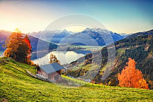 Spectacular autumn view of lake meadows trees and mountains in Sell Am See
