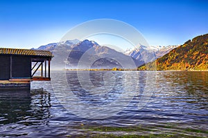 Spectacular autumn view of lake meadows trees and mountains in Sell Am See