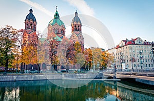 Spectacular autumn view of Landmark Protestant St. Luke`s Church. Bright morning cityscape of Munich, Bavaria, Germany, Europe. Tr