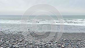 Spectacular big beautiful waves on pebbly beach in Georgia, Batumi