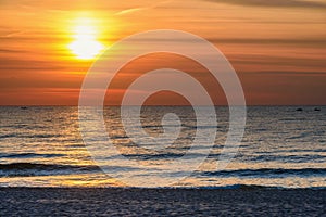 Spectacular bright golden sunset over Baltic sea