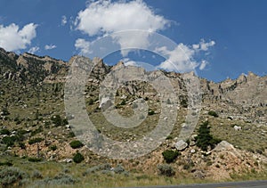 Spectacular buttes and geologic formations seen along the road from North Fork Highway in Wyoming, upward shot