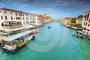 Spectacular canal with restaurant, hotels, boats in Venice, Italy, Europe