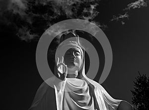 Spectacular cloud over the statue of GuanYin, the Goddess of Mercy and Compassion in the buddhist religion