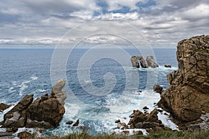 Spectacular coastal landscape with steep cliffs and rock formations carved out by the wave action of the Cantabrian Sea