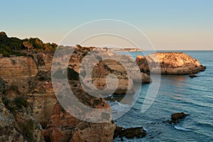 Spectacular colors of the limestone rocks at sunset. Algarve region, Portugal