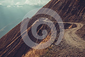 Spectacular and dangerous mountain road, Tusheti, Georgia. Adventure concept. Mount landscape. Unpaved winding road. Dirt serpenti