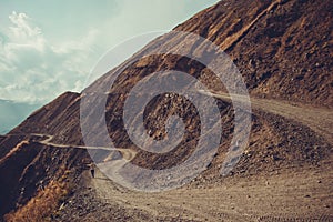 Spectacular and dangerous mountain road, Tusheti, Georgia. Adventure concept. Mount landscape. Unpaved winding road. Dirt serpenti