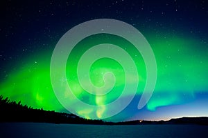 Intense display of Northern Lights at morning dawn photo