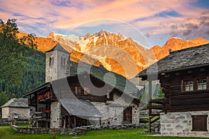 Spectacular east wall of Monte Rosa at dawn from the picturesque and characteristic alpine village of Macugnaga - Staffa , Italy