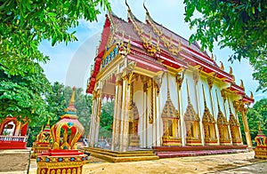 Spectacular exterior of Ubosot of Wat Suwan Kuha Cave Temple, Phang Nga, Thailand photo