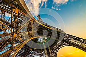 Spectacular unique colourful wide angle shot of the Eiffel tower from below, showing all pillars.