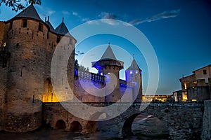 Spectacular Illuminated Ancient Fortress Of Medieval City Carcassonne In The Night In Occitania, France