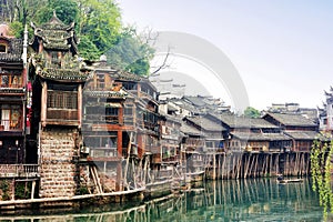 The Diaojiaolou traditional Chinese gabled wooden houses built on stilts be preserved in Fenghuang photo