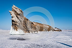 Spectacular landscape of the Dragon tail rock located at Ogoy island in frozen lake Baikal in winter season.