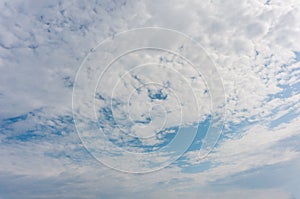 Spectacular light altocumulus clouds on the sky on a summer day. Natural background