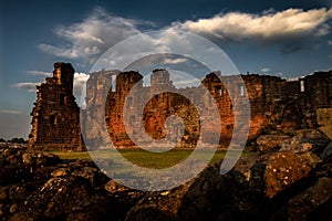 Spectacular moody sunset view of Penrith Castle in Cumbria