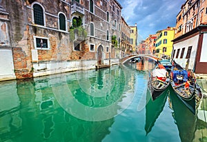 Spectacular narrow canal with gondolas in Venice, Italy, Europe