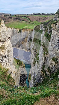 Spectacular natural cliffs Aval of Etretat and beautiful famous coastline, Normandy, France