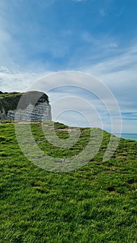 Spectacular natural cliffs Aval of Etretat and beautiful famous coastline, Normandy, France