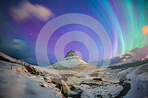 Spectacular northern lights appear over Mount Kirkjufell photo