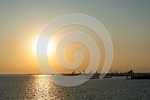 Spectacular panorama view of sun setting into Thermaic gulf. photo