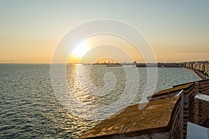 Spectacular panorama view of sun setting into Thermaic gulf. photo