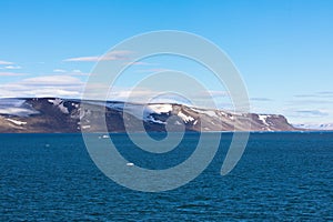 Expeditions cruise in the arctic ocean with view of die mountain landscape. Svalbard. photo