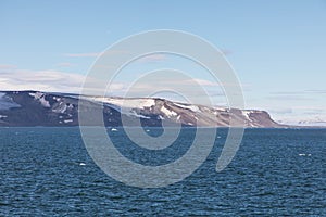 Expeditions cruise in the arctic ocean with view of die mountain landscape. Svalbard. photo