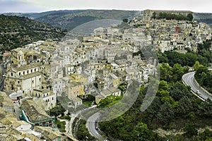 Spectacular scenic view of colorful houses in old Ragusa Ibla and a winding road in Sicily