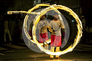 A spectacular site as Fire Ball Dancers perform along a street in Kandy during the Esala Perahera in Sri Lanka.