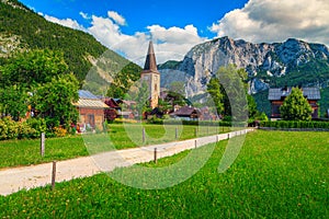 Wonderful green fields and alpine village with church, Altaussee, Austria